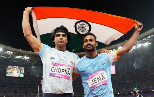 Silver medalist India's Kishore Kumar Jena, right, and gold medalist India's Neeraj Chopra, celebrate after the men's javelin throw final at the 19th Asian Games